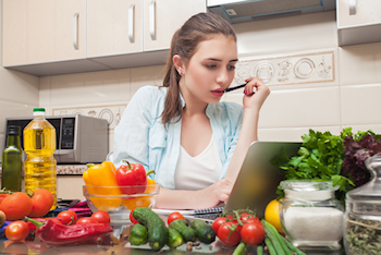 Woman with vegetables in the kitchen